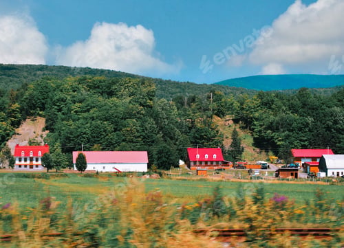 Preview: Beautiful houses with red roofs on a farm in the province of Quebec Canada