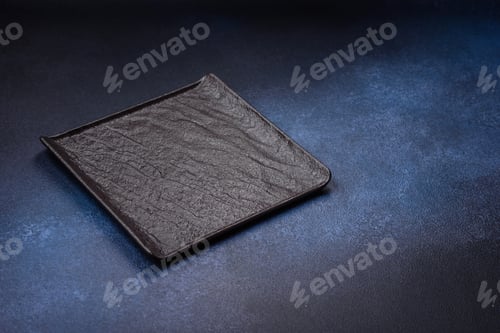 Preview: Round empty colored ceramic plate on concrete texture background