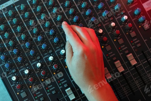 Preview: The musician adjusts the sound on audio mixer