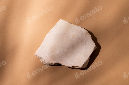 Preview: Beige stone slab on a light brown background with a shadow.