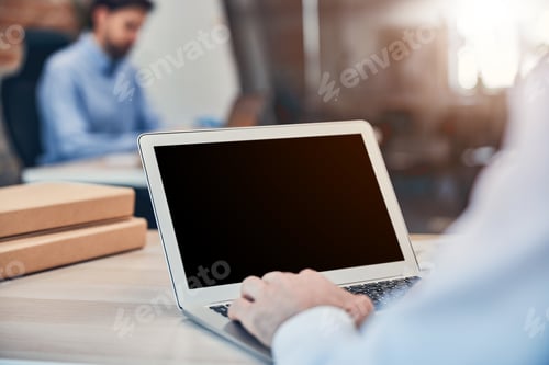 Preview: Male is working on laptop at workplace