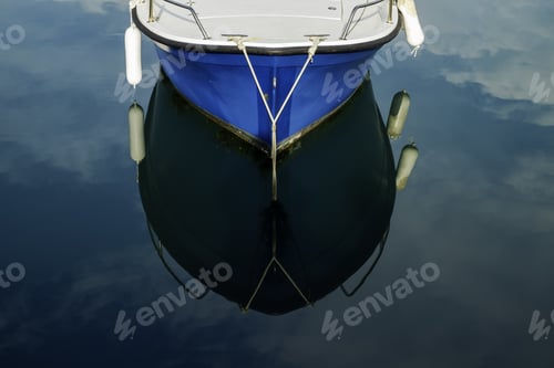 Preview: Top view of a small boat reflected on a seawater