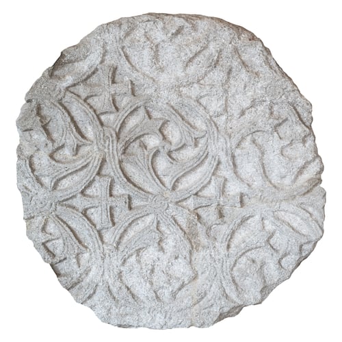 Preview: large round plaque of stone carved with floral pattern and ragged edges isolated on white