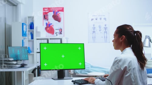 Preview: Medic writing diagnose on computer
