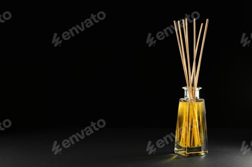 Preview: Reed air freshener on black background, space for text