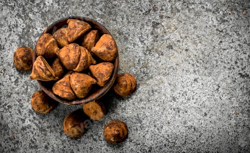 Preview: Chocolate truffles in a bowl.