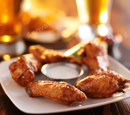 Preview: buffalo barbecue hot chicken wings around ranch sauce with celery