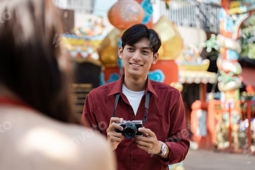 Preview: Joyful Traveler Exploring Vibrant Chinese New Year Celebrations with Camera in Hand