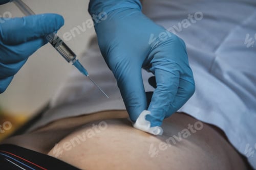 Preview: Medical Professional Administers Injection Into Patient Abdomen Indoors