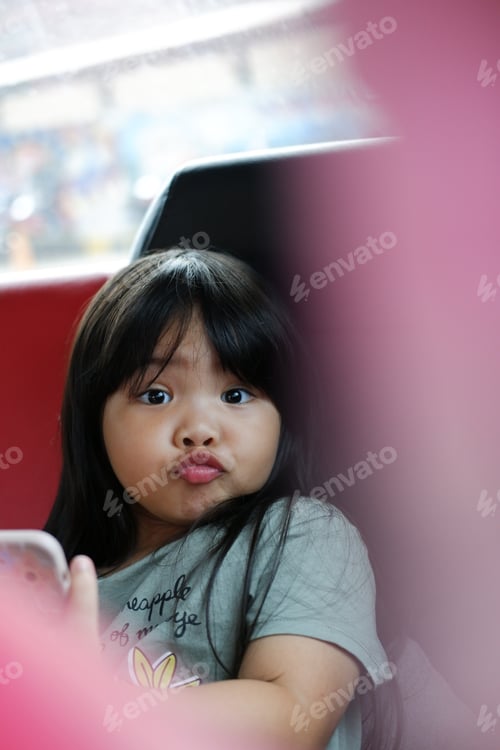 Preview: Cute face of little girl with foreground