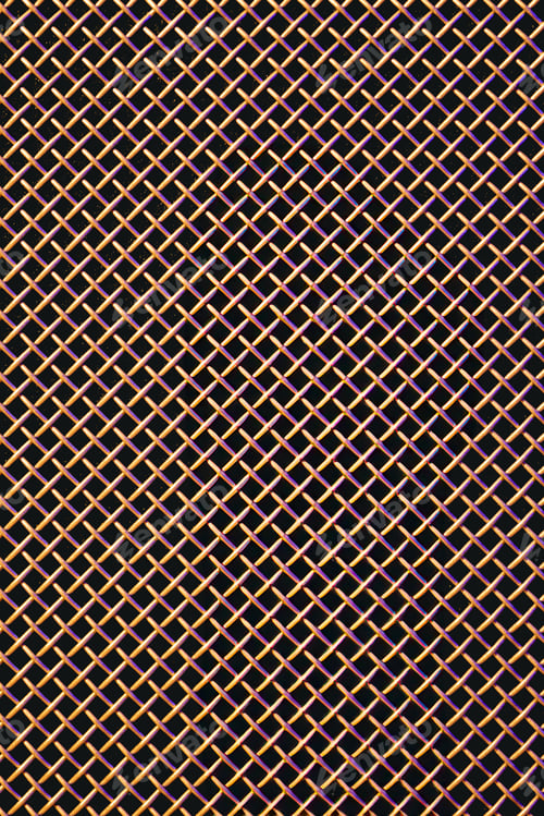 Preview: Metal grill close-up, texture of a music speaker in colored lighting.