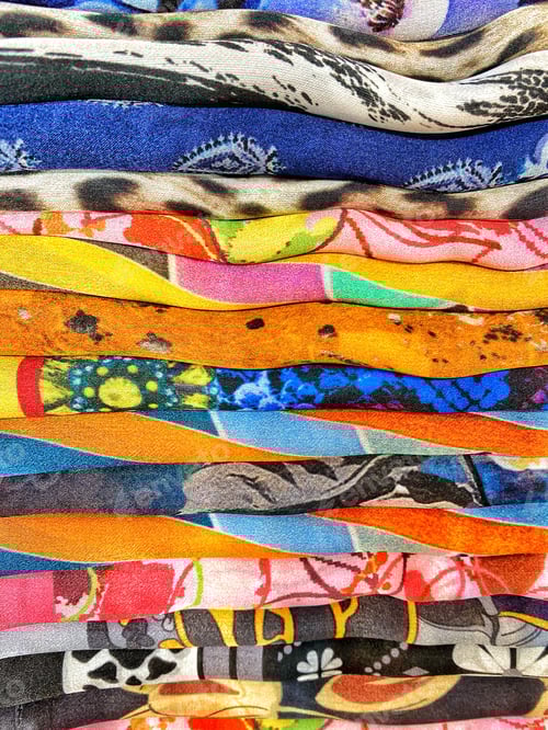 Preview: Colorful comfortable tee shirts textile fabric clothing on display on a retail store shelf