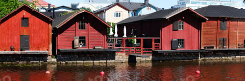 Preview: Red harbor warehouses with nice reflections on porvoo river. fishing village in scandinavian style