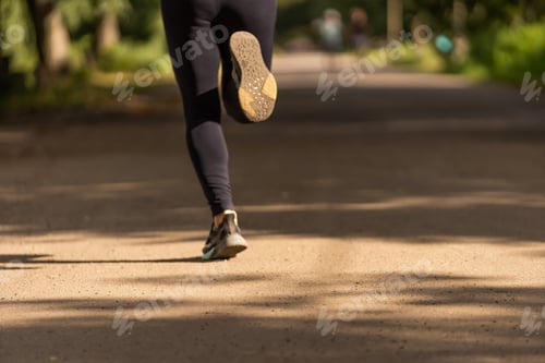 Preview: young fitness woman runner athlete running at road