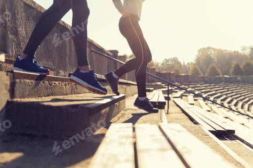 Preview: close up of couple running downstairs on stadium