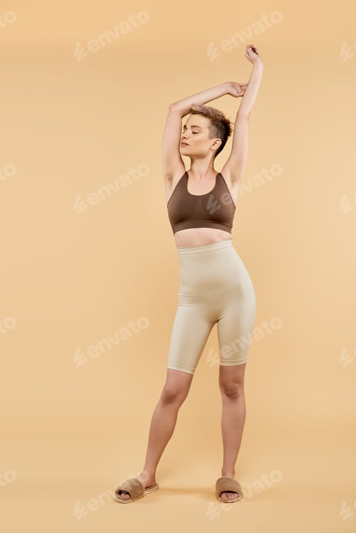 Preview: Woman in Lounge Wear Stretching Arms Upward