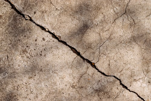 Preview: Crack on cement floor, mossy rough concrete surface top view