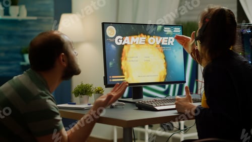 Preview: Gaming over for nervous pro couple gamers, playing space shooter