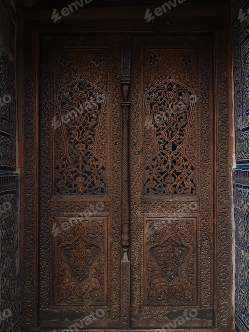 Preview: Ornamental carved door in tiled oriental wall