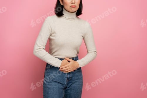 Preview: Portrait of woman clutching belly suffering stomach ache, gastritis or constipation