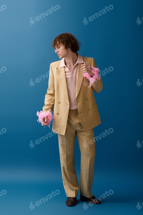 Preview: Teenager showcases vibrant fashion statement while posing confidently in colorful attire