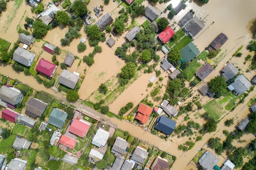 Preview: Aerial view of flooded houses with dirty water of Dnister river in Halych town, western Ukraine.