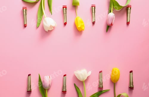 Preview: Flat lay composition with different lipsticks and tulip flowers on color background, space for text