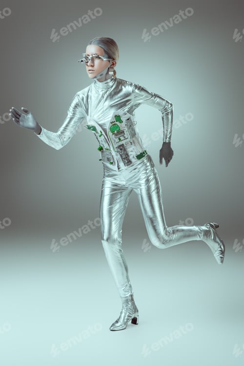 Preview: full length view of silver woman robot running on grey, future technology concept