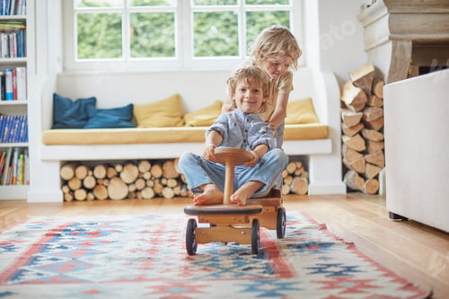 Preview: Two young brothers playing with wooden toy car