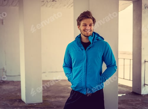 Preview: Portrait of sporty man in a blue jacket. summer time