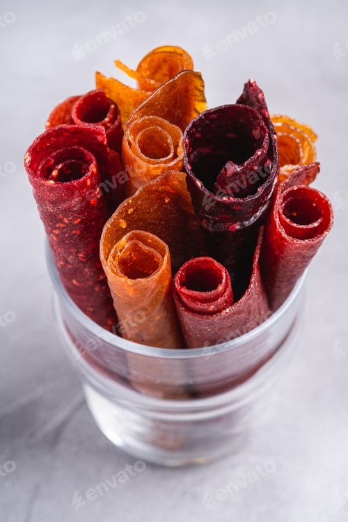 Preview: Fruit pastille in glass cup on stone concrete background