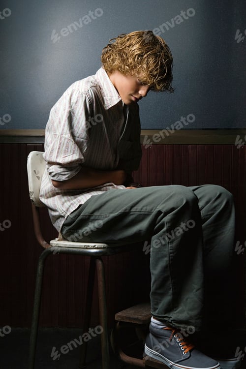 Preview: Teenage boy sat alone