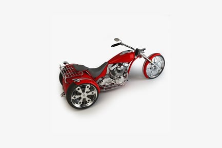 Preview: Three-wheeled motorcycle with low-slung frame and prominent engine