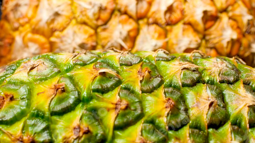 Preview: Closeup abstract image of green and yellow skin of fresh pineapple