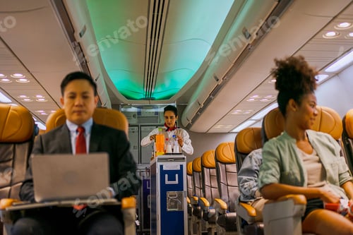 Preview: Passengers are sitting in the passenger cabin while travel by commercial air plane.