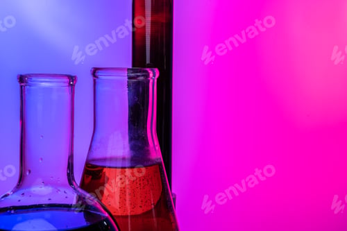 Preview: Laboratory glass tubes with chemicals on bright pink background