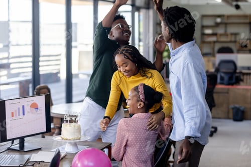 Preview: In office, diverse team celebrating birthday, sharing cake and cheerful moment together