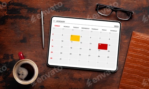 Preview: Tablet with calendar app, coffee cup and office supplies