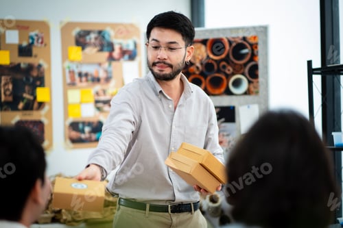 Preview: Group of young male and female business people in the office