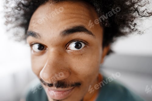 Preview: Young man staring wide eyed with curiosity