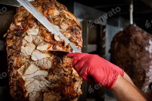 Preview: Fried meat on a skewer for cooking of donors or shawarma. Close-up