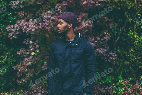 Preview: Man Posing in Front of Colorful Foliage