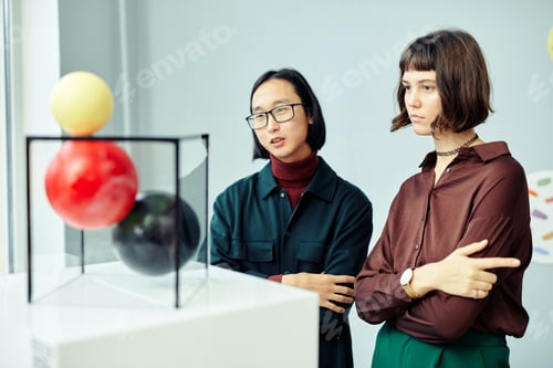 Preview: Art Gallery Visitors Looking At Installation