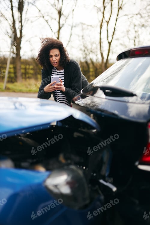 Preview: Female Driver Taking Photos Of Road Traffic Accident On Mobile Phone For Insurance Claim