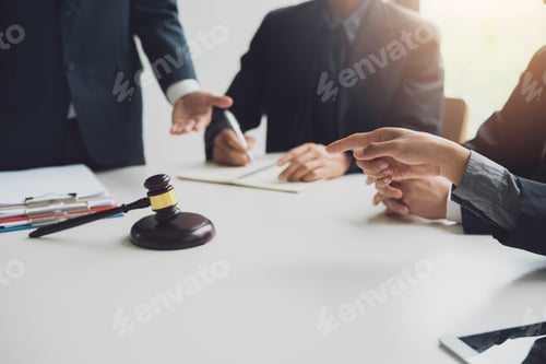 Preview: Businessmen and lawyers meeting and discuss lawsuit in the office.