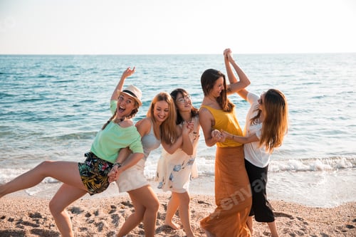 Preview: Happy multiracial young women people at the beach. Friends and holiday concept.