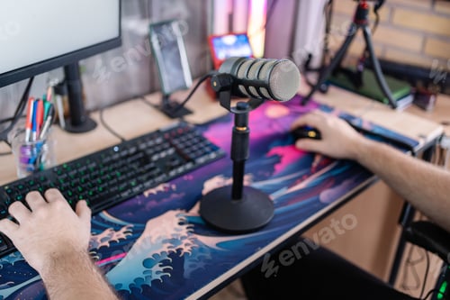Preview: Gamer streaming live, playing and talking into microphone
