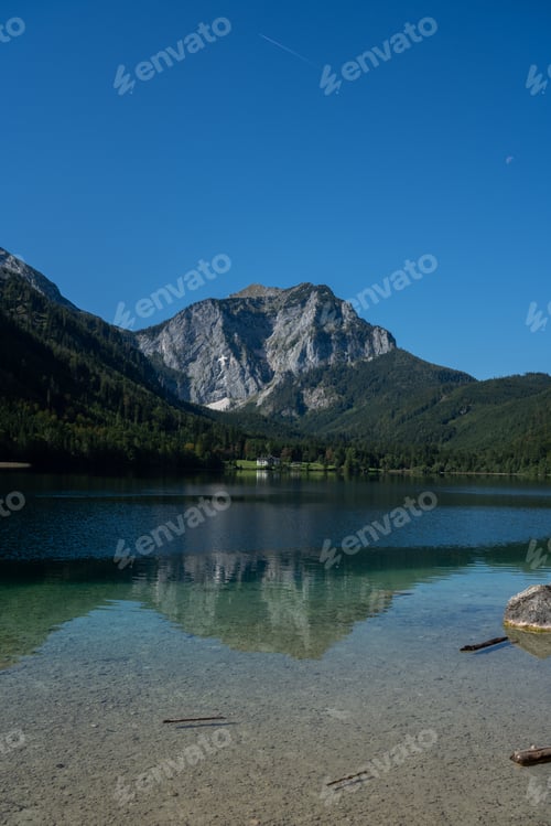 Preview: Pure lake with mountains in the background