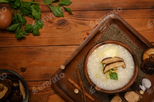 Preview: Delicious rice porridge with soft boiled egg, shiitake mushroom, slice ginger and slice scallion.