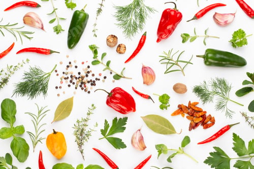Preview: Spice herbal leaves and chili pepper on white background.